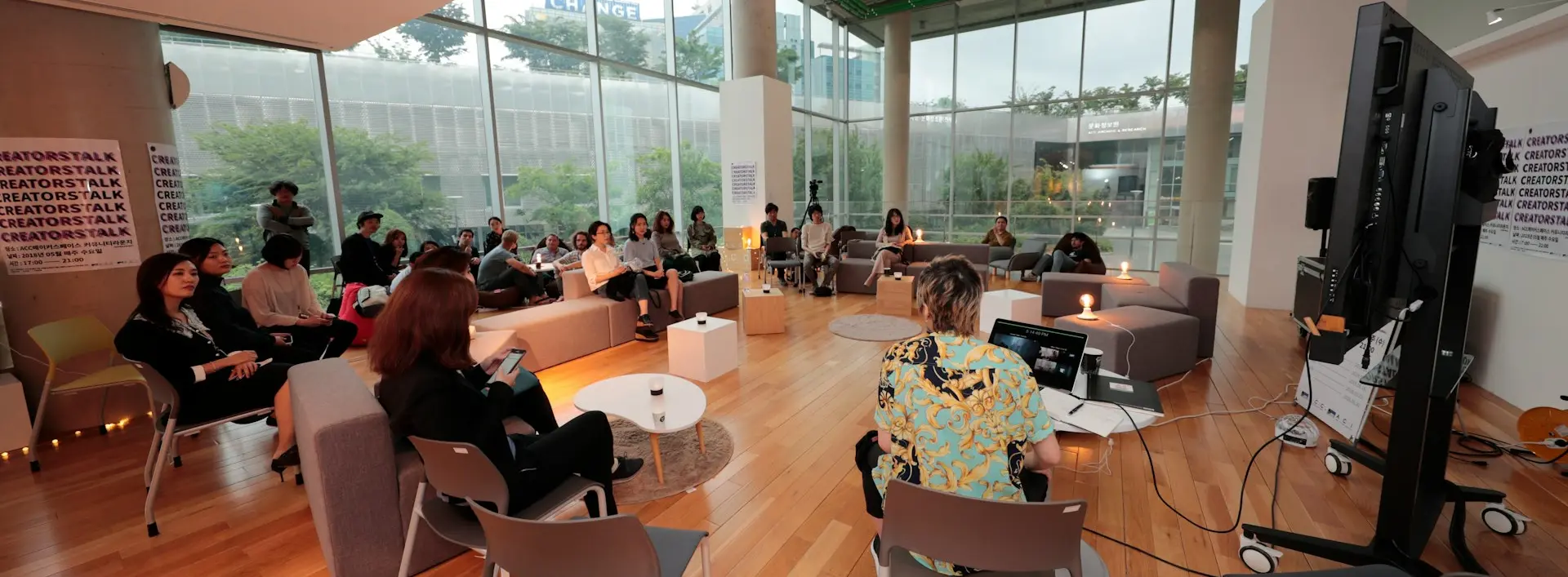 a group of people sitting in chairs in a room